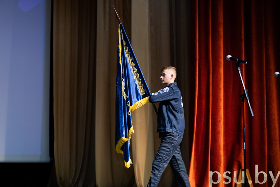 Kirill Romanov Carrying the Flag of the University